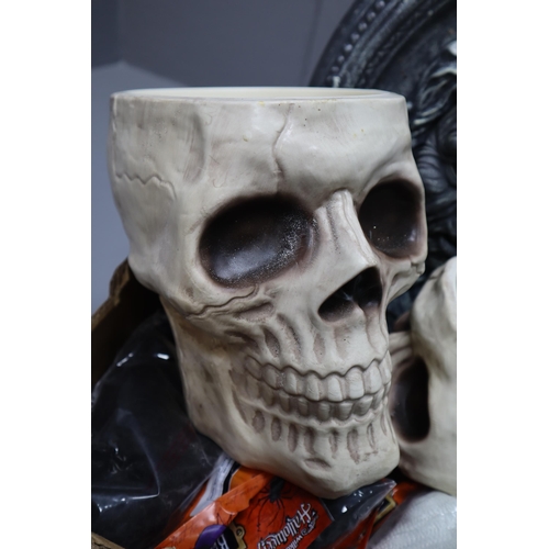 989 - A Large Selection of Halloween Decorations To Include Skull Bowls, Skeleton, Spider Webs, And More. ... 