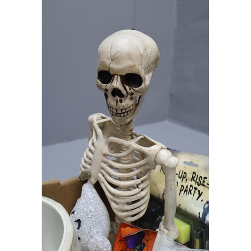 989 - A Large Selection of Halloween Decorations To Include Skull Bowls, Skeleton, Spider Webs, And More. ... 