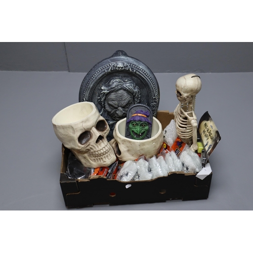 989 - A Large Selection of Halloween Decorations To Include Skull Bowls, Skeleton, Spider Webs, And More. ... 