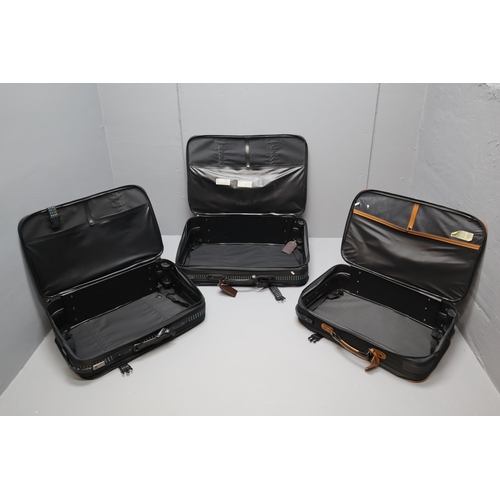 955 - Two Carlton suitcases one medium and one small and a small carry Couture suit case