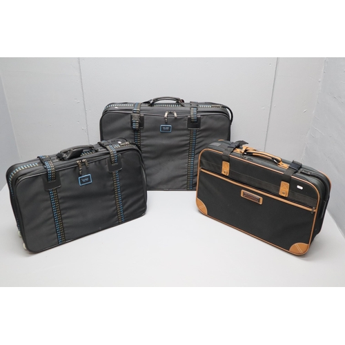 955 - Two Carlton suitcases one medium and one small and a small carry Couture suit case