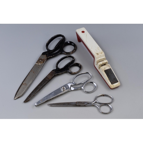 809 - Four pairs of scisors to include large and medium dress making scissors 11