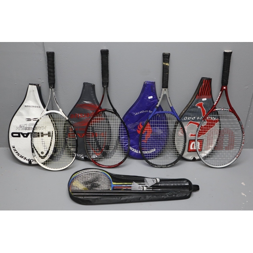 942 - Four tennis rackets (will require the grips re taping as they have sticky residue on the handles) an... 