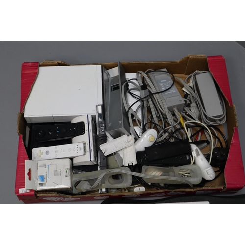 943 - Large Selection of Gaming Items to include 3 X Wii consoles, Controllers, Wii Games, Wii Fit Board, ... 