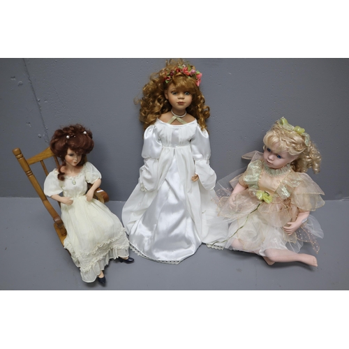 958 - A Selection of Three Porcelain Dolls To Include Leonardo Collection, Doll Seated on Rocking Chair, A... 