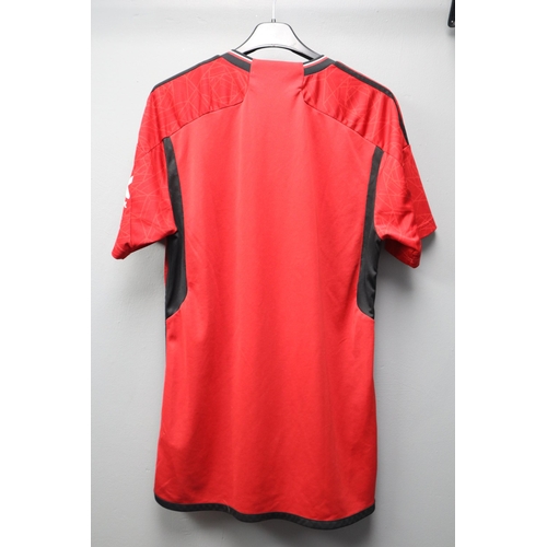 554 - Official Manchester United adidas Football Shirt (Size L)