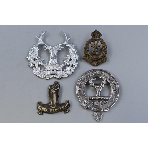 296 - Four Badges including Royal Airforce Medical Branch, Gordon Highlanders, Ross Clan Pewter Brooch and... 