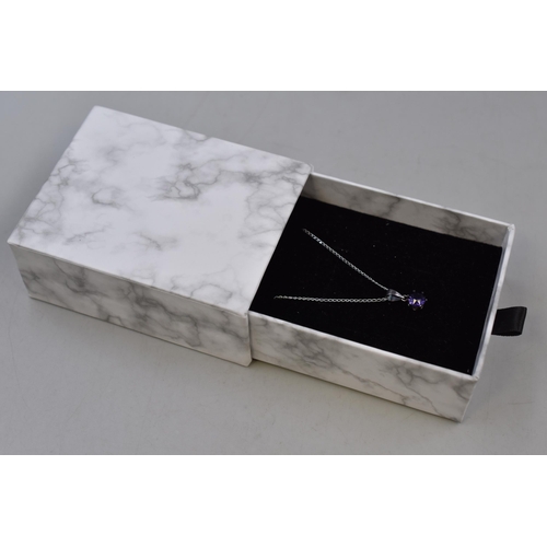 94 - A Purple Stoned 925. Silver Pendant Necklace, With Presentation Box