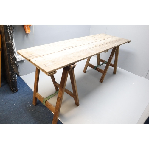 563 - A Vintage Wooden Folding Decorator's Table With Two Trestles. Approx 6ft x 2ft Tabletop.