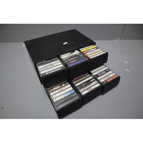 571 - A Selection of Cassette Tapes In Cassette Box To Include New Order, Pretenders, Simple Minds, Jackso... 