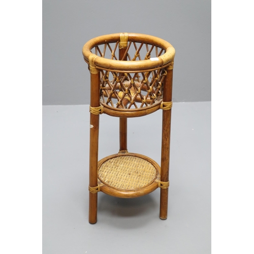 660 - Decorative Bamboo Rattan Plant Holder ( approx 2Ft in Height ) Complete With Artificial Swiss Cheese... 