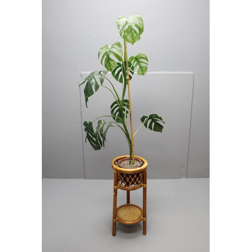 660 - Decorative Bamboo Rattan Plant Holder ( approx 2Ft in Height ) Complete With Artificial Swiss Cheese... 