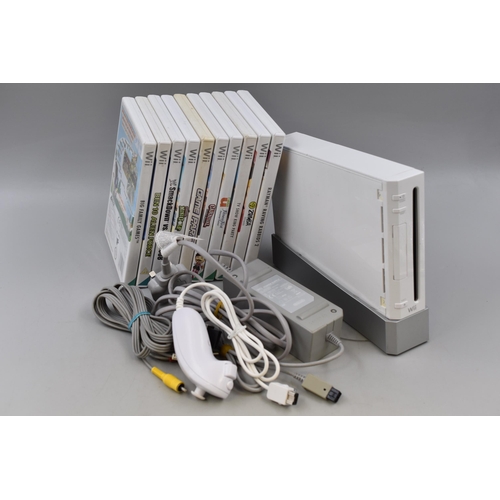 589 - A Nintendo Wii Console, With Leads, Nunchuk, And A Selection of Games