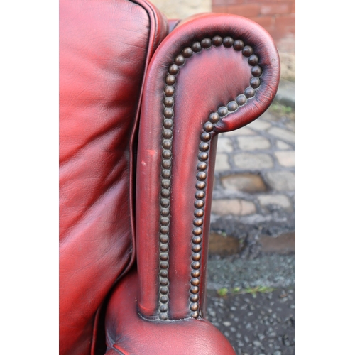 665 - Vintage Buttoned Rolled Arm Two Seater Leather Chesterfield in Oxblood on Castors a/f approx 50