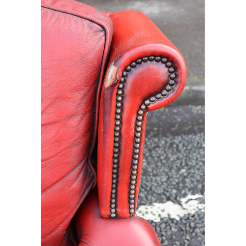 667 - Vintage Buttoned Rolled Arm Three Seater Leather Chesterfield in Oxblood on Castors a/f approx 64