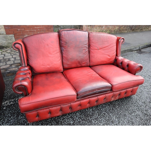 667 - Vintage Buttoned Rolled Arm Three Seater Leather Chesterfield in Oxblood on Castors a/f approx 64