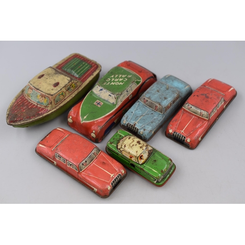 228 - Collection of 6 vintage tin vehicles to include three 1950s glam toy cars, a Monte Carlo rally, a bo... 