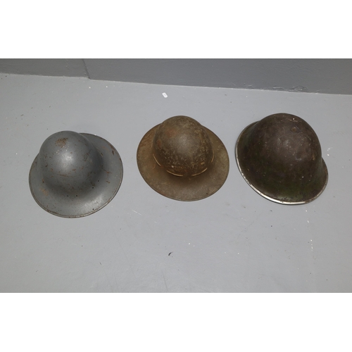 682 - Three Metal Military Helmets. To Include WWII Zuckerman, And Turtle Helmet. AF