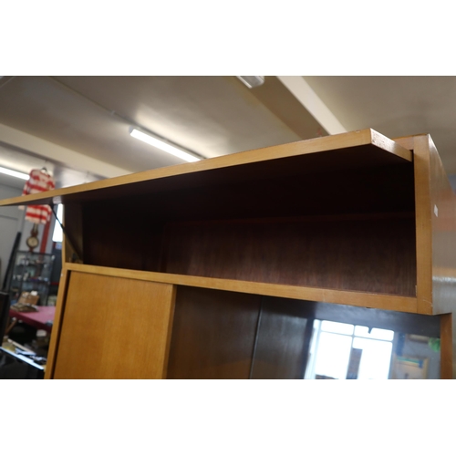 688 - A Mid century dressing table/wardrobe unit with sliding wardrobe door and four drawers with mirror a... 