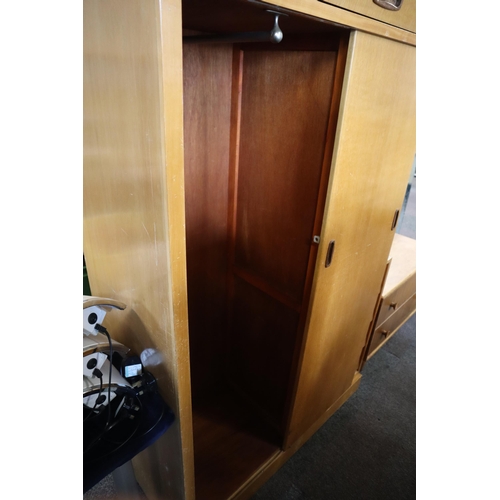 688 - A Mid century dressing table/wardrobe unit with sliding wardrobe door and four drawers with mirror a... 