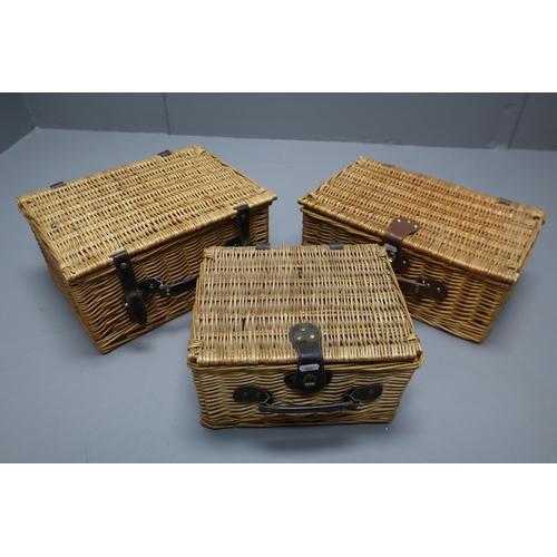 694 - Three Rattan Storage Baskets with one Containing Cutlery