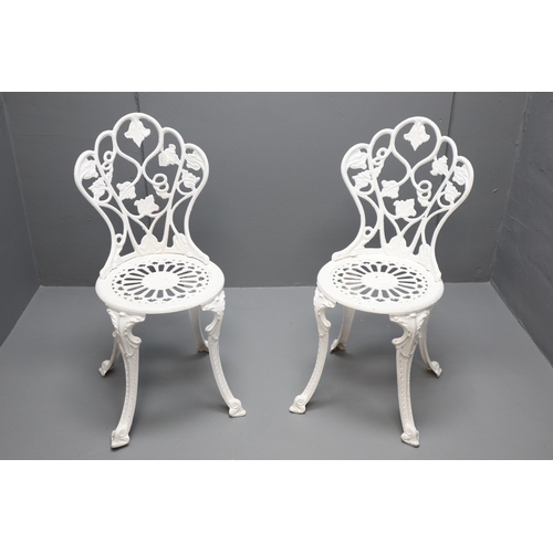 646 - A Pair of Cast Metal Garden Chairs, In White. Approx 34