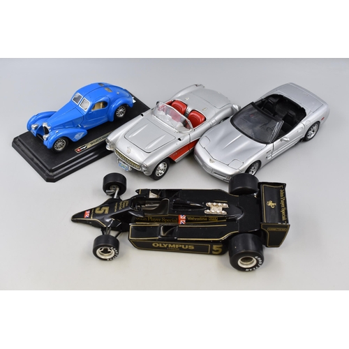 202 - Four Larger Scale (1/24-1/14) Model Cars. Includes Chevrolet Corvette 1957, 2001 Corvette, John Play... 