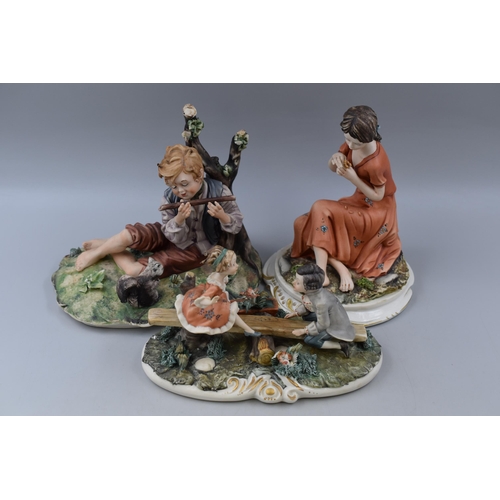 336 - Three Pieces of Capodimonte To Include Girl With Flower, See-Saw, And Boy With Flute. Tallest Approx... 