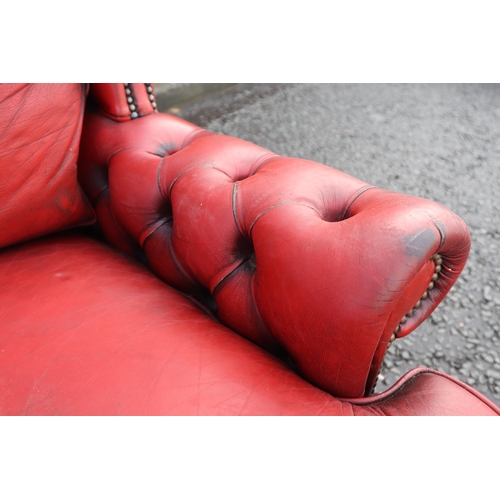 667 - Vintage Buttoned Rolled Arm Three Seater Leather Chesterfield in Oxblood on Castors a/f approx 64