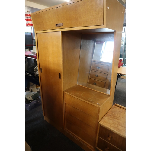 688 - A Mid century dressing table/wardrobe unit with sliding wardrobe door and four drawers with mirror a... 