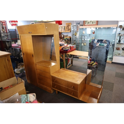 688 - A Mid century dressing table/wardrobe unit with sliding wardrobe door and four drawers with mirror a... 