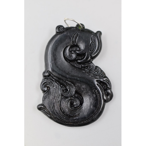 61 - A Jade Oriental Phoenix Pendant