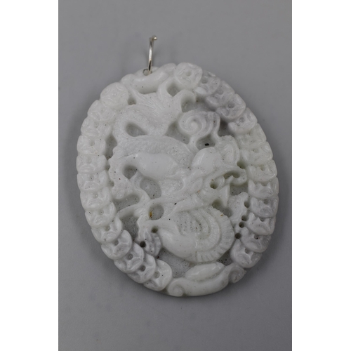 63 - A Carved Oriental Dragon Jade Pendant