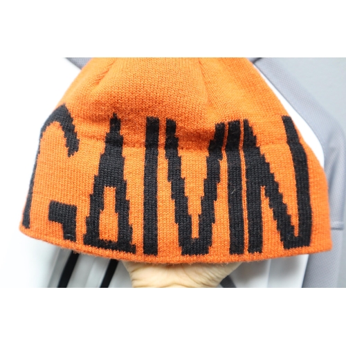 556 - Galvin Green golfers top and an orange Galvin Green bobble hat