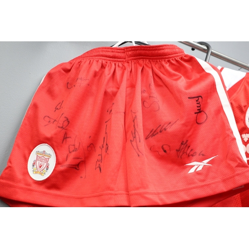 560 - Three Liverpool Football Club Items to Include Two Tops and a Signed Toddlers Top and Shorts (unknow... 