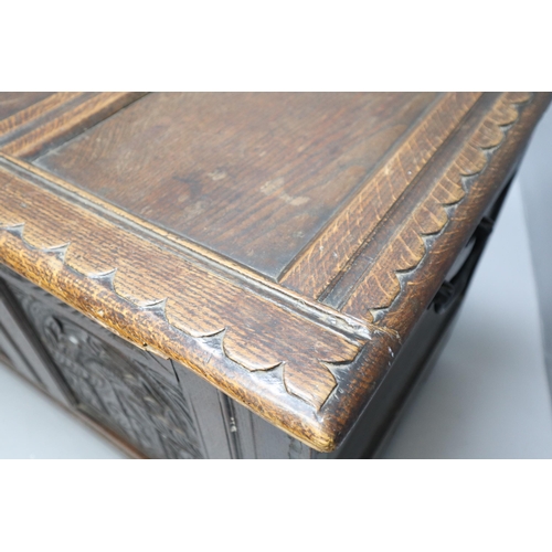 604 - A Large Antique Oak Thirteen Panel Bedding Box On Wooden Castors, With Carved Art Nouveau Front Pane... 