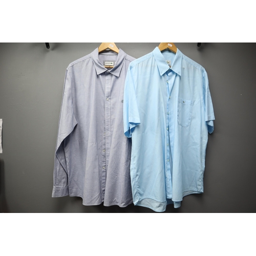 577 - Four mens designer XXL shirts, 3 dress shirts to include 2 Lacoste, 1 BOSS and a long sleve black po... 