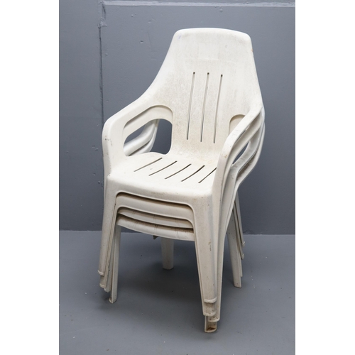 652 - Four White Plastic Garden Chairs