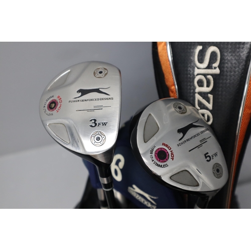 654 - A set of Slazenger golf clubs in a Nike golf bag with an Oddessy hot GX putter and Slazenger K1 spee... 