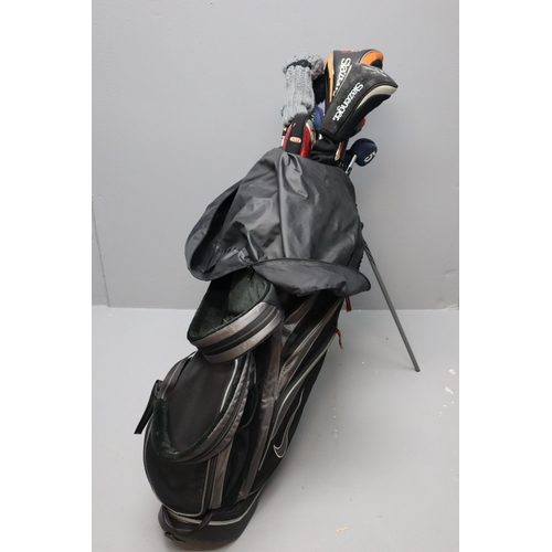 654 - A set of Slazenger golf clubs in a Nike golf bag with an Oddessy hot GX putter and Slazenger K1 spee... 