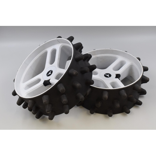 583 - Two golf caddy snow wheels with big rubber knobblies