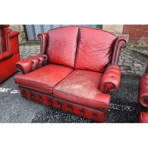 596 - Vintage Buttoned Rolled Arm Two Seater Leather Chesterfield in Oxblood on Castors a/f approx 50