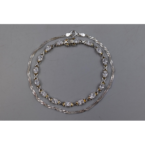 143 - Two IBB Silver Bracelets. Includes 925. Silver Cz Stoned Cross 'IBB' Bracelet, And IBB Twisted Chain... 