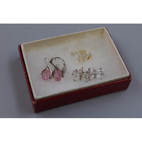 191 - Three Pairs of 925. Silver Earrings To Include Clear Stoned Butterfly, Pink Stoned, And 'D'