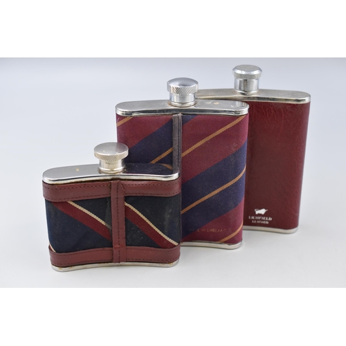 269 - Three Fabric and Leatherette Covered Hip Flasks