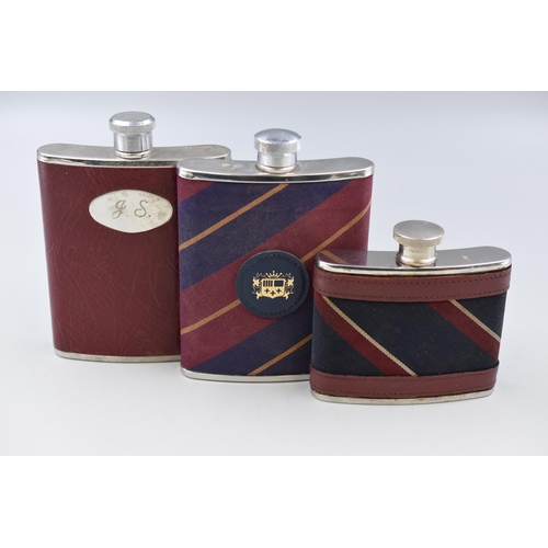 269 - Three Fabric and Leatherette Covered Hip Flasks