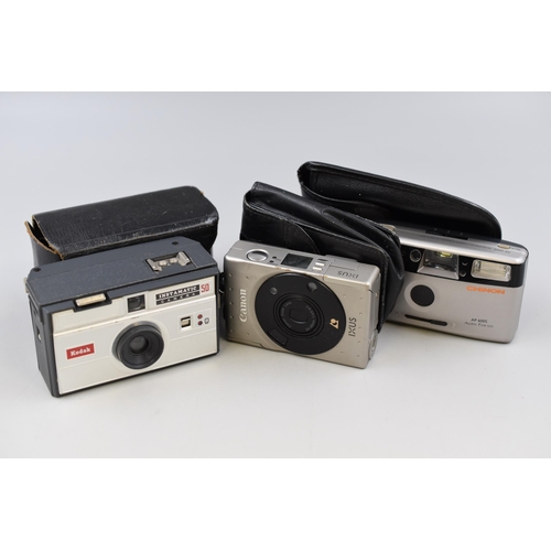 460 - Three Cameras including Canon IXUS with Case, Chinon Auto and Instamatic 50 with Case