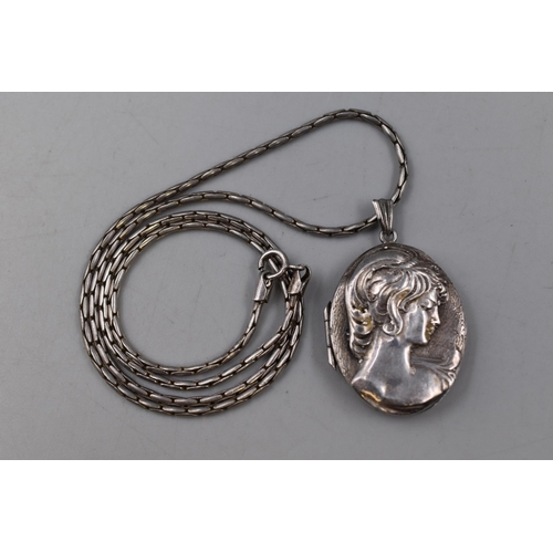 34 - A Hallmarked Silver Locket with Silver 925 Chain, which is 20