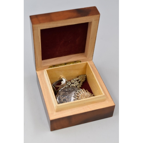 36 - Small Wooden Box containing four Silver Brooches and one Silver Ring