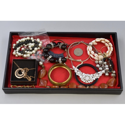 258 - A Selection of Designer Jewellery To Include Amber Style Beaded Necklace, Gold Tone Bangle, Concentr... 